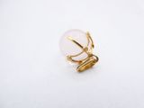 a close up of a ring on a white surface