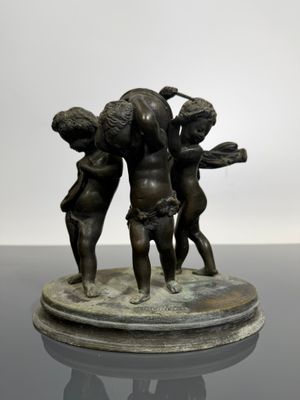 bronze sculpture of three cherenshes on a marble base
