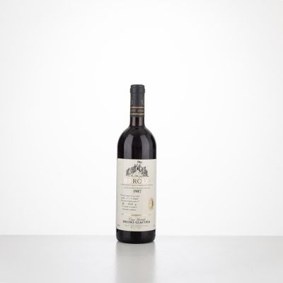 a bottle of red wine sitting on top of a table