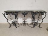a table with a marble top on it in a room