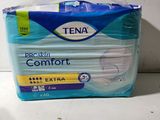 a box of tena comfort extra pads on a counter