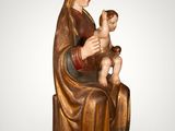 an image of a statue of a woman holding a child