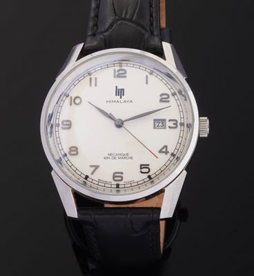 an image of a close up of a wrist watch on a black surface