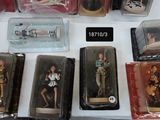 a lot of action figures on display in a box