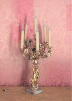 CANDELABRE en bronze ciselé et doré à décor d'un putti soute…