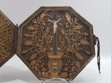 a small decorative box that has a cross on it