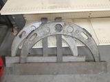 a picture of a metal arch with holes in it