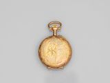 une montre de poche en or dont le cadran est orné d'un motif floral