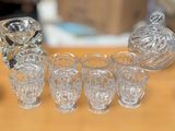 a lot of glass items sitting on a table