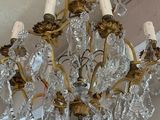 a chandelier hanging from the ceiling in a room