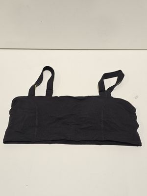 black sports bra top with adjustable straps on a white surface