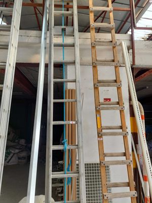 a ladder that is leaning against a wall in a building