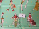 a green fabric with a picture of women on it