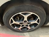 a close up of a car ' s tire on the street