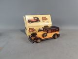 a small toy car with a box on the back of it