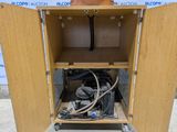 a wooden cabinet with a bunch of wires in it