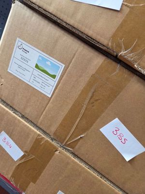 boxes are stacked on top of each other in a warehouse