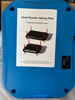une boîte bleue sur laquelle figure l'image d'une plaque chauffante « Smart Broder »