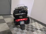 a motorcycle that is parked in a room with a checkered floor