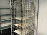 an image of a large metal rack with trays on it