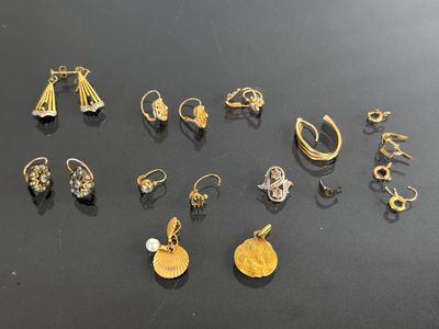 a close up of a bunch of earrings on a table