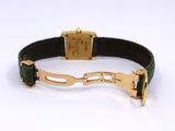 a close up of a bracelet with a horse ' s head on it