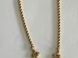gold plated necklace with a tear shaped pendant on a chain
