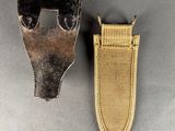 pair of old tools sitting on a table next to each other