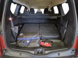 the back of a car with the trunk open with luggage in it