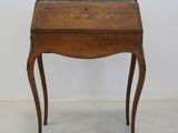 a small wooden table with a drawer on top of it