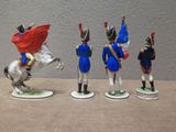 five figurines of soldiers on display on a table