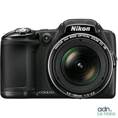 the camera is black and has a lens attached to it
