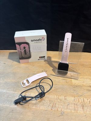 a smart phone that is sitting on a table next to a box