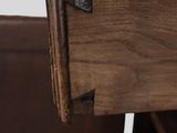 a close up of a wooden drawer with a drawer underneath it