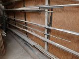 a long metal shelf in the middle of a room