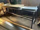 several pieces of metal are stacked on top of each other in a warehouse