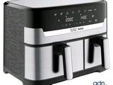une friteuse à air chaud équipée d'une horloge numérique