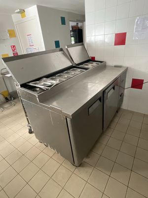 tiled floor in a commercial kitchen with stainless steel counter tops