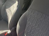 two seats in the back of a car with a seat belt