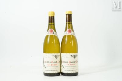 two bottles of wine sitting next to each other on a white surface