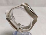 a watch that is sitting on top of a glass stand