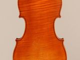 an old violin with a wooden back and a long neck