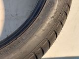 the tire of a car that is sitting on the side of the road