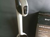 a black and white blender sitting on a table next to a box