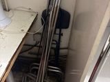 a toilet in the corner of a bathroom with a sink