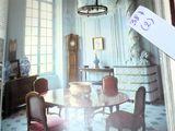 an open book with a picture of a dining room in it