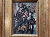 a painting of a woman holding a cat on a table