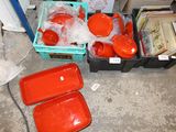 many plastic containers that are sitting on the floor
