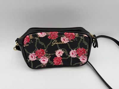 GUESS : Sac bandoulière en similicuir noir à décor de fleurs…