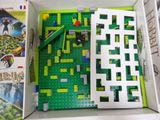 a box that has a game in it and some books